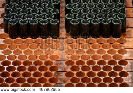 Production Of Cremant Sparkling Wine In Burgundy, France. Automatically Powered Bottling And Riddlin