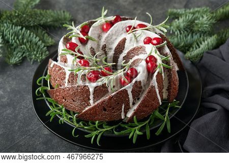 Christmas Chocolate Bundt Cake. Traditional Christmas Fruit Cake With White Glaze, Cranberries And R