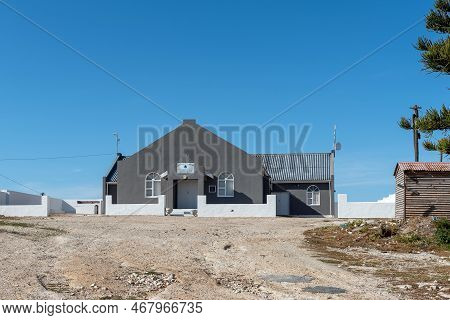 Arniston, South Africa - Sep 22, 2022: A Street Scene, With The Assemblies Of God Church, In Kassies