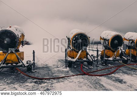 Snow Cannons Spray Artificial Snow Crystals. Cars Make Snow. Snow Guns. Production Of Artificial Sno