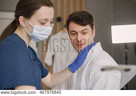 Man In Cosmetologist Cabinet Is Going To Recieve A Skincare Procedure