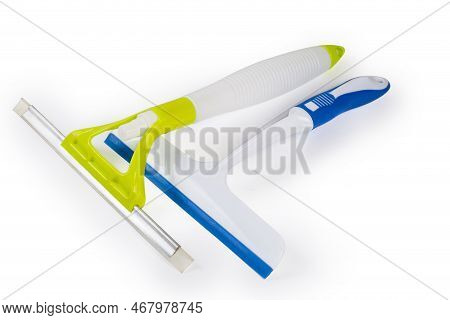 Two Different Domestic Plastic Scrapers, One Of Them With Inbuilt Spray Bottle For Flat Glass Surfac