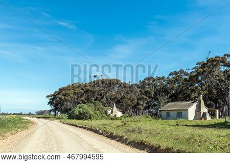 Struisbaai, South Africa - Sep 22, 2022: Farm Worker Houses At Prinskraal Next To The Road Between A