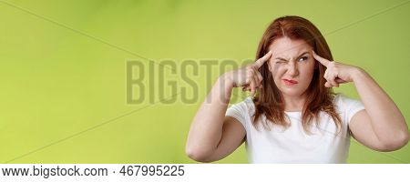 Difficult Decision. Perplexed Hesitant Redhead Middle-aged 50s Woman Trying Solve Puzzle Look Puzzle