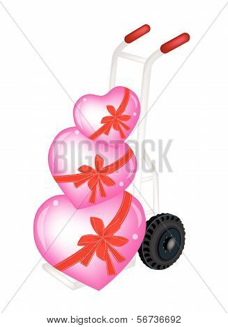 Hand Truck Loading Three Beautiful Red Heart