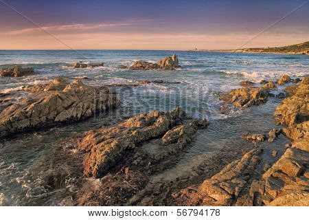 Coriscan Rocks In Sea At Dusk