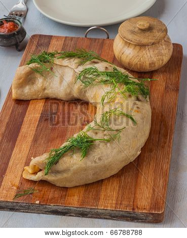 Steam Roll Stuffed With Meat On A Cutting Board