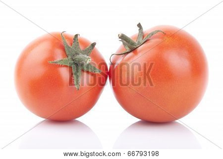 Two Red Tomatoes Isolated On A White Background.