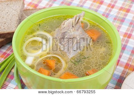 Chicken Soup With Meat And Greens On A Plate.