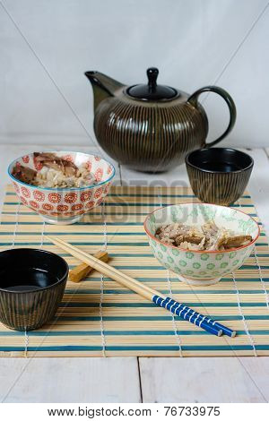Chinese lunch set with rice and duck meat, tea