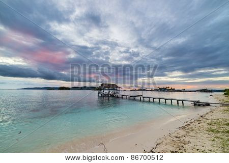 Seascape And Cloudscape With Jetty At Dusk
