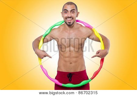 Man doing excecises with hula hoop