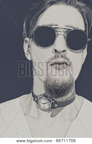 Portrait Of Young Punk In Round Sunglasses
