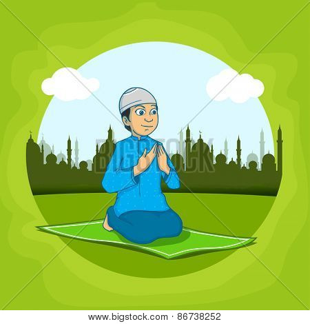 Religious Muslim boy, reading Namaz (Namaz, Muslim prayer) in front of mosque,  Concept for Islamic holy month of prayers, Ramadan Kareem. 