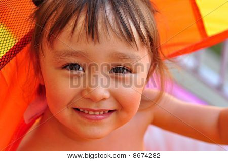 Portrait of a happy little girl close-up