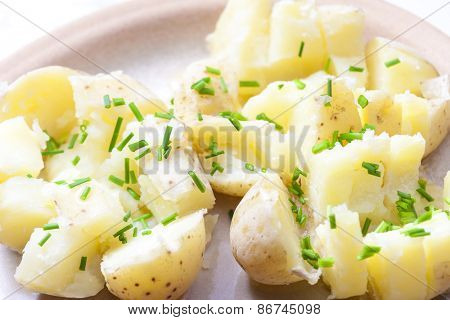boiled unpeeled potatoes with chives