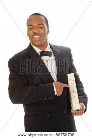 African American preacher holding and pointing at a bible, while preaching, isolated over white