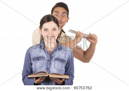 angry young man ready to throw book from behind towards naive sweet girl