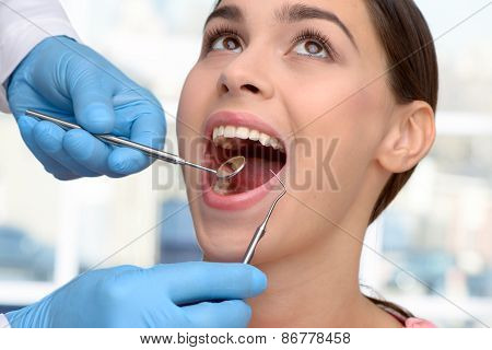 Beautiful woman visiting dentist