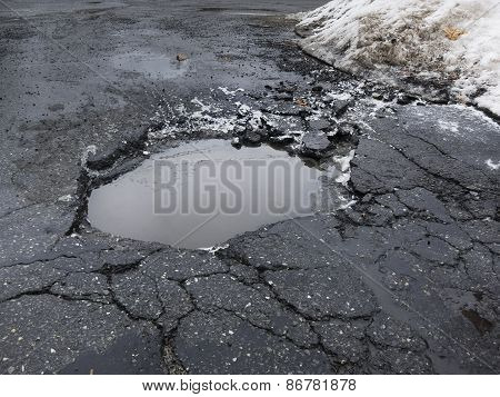 Big pothole in road