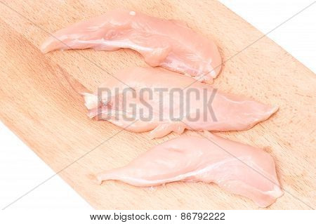 Chicken fillet on a wooden background
