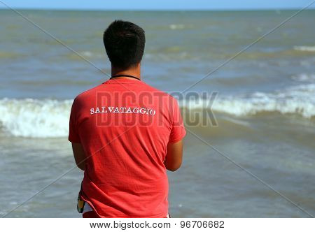 Italian Lifeguard With Red Shirt With The Italian Written Rescue