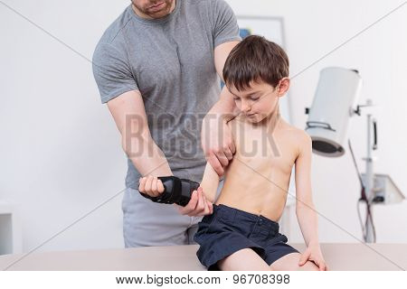 Therapist Exercising With Little Patient