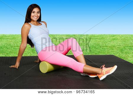Woman using a foam roller after a workout