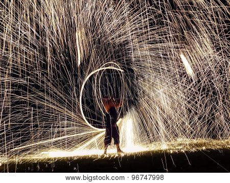 Firestarter Performing Amazing Fire Show With Sparkles In The Night