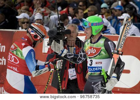 SOELDEN, AUSTRIA Oct 25 2009 Didier Cuche (SUI) gets congratulated by Ted Ligety (USA) after winning the mens giant slalom race at the Rettenbach Glacier.