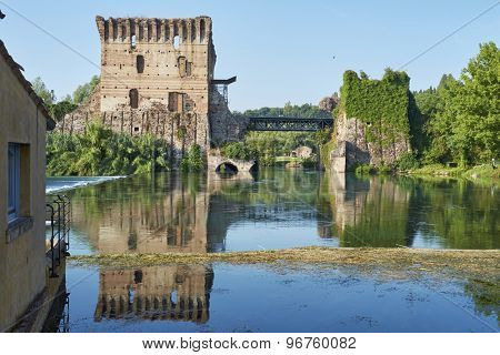 BORGHETTO, ITALY - JULY 11: Ruin of tower at Visconteo bridge coasted by river Mincio. July 11, 2015 in Borghetto.
