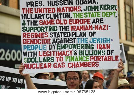 Man holding detailed sign