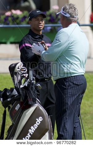 ST ANDREWS, SCOTLAND. July 17 2010: Tiger WOODS from the USA and Darren CLARKE from Northern Ireland during the third round of The Open Championship played on The Royal and Ancient Old Course