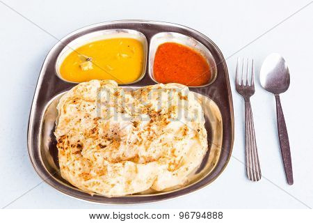 Roti Prata or Roti Canai, a traditional Indian bread served with curry
