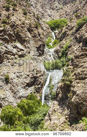 view of mountains and a waterfall