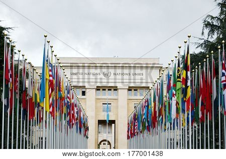 GENEVA, SWITZERLAND - SEPTEMBER 16, 2016: View of the entrance to United Nations (Palace of Nations) and world flags in Geneva, Switzerland. United Nations was established in Geneva in 1947