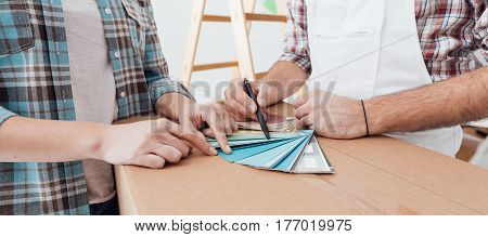 Woman Picking A Color For Her Walls