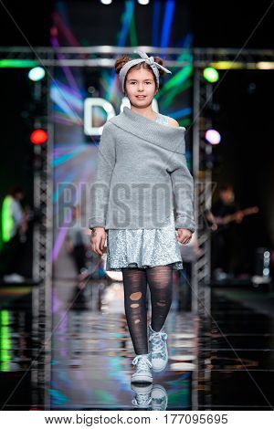 MOSCOW RUSSIA - MARCH 12 2017: Model walk runway for DETSKY MIR catwalk at Fall-Winter 2017-2018 at Mercedes-Benz Fashion Week Russia. Kid's fashion.