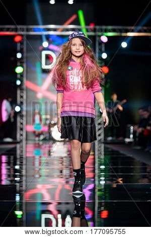 MOSCOW RUSSIA - MARCH 12 2017: Model walk runway for DETSKY MIR catwalk at Fall-Winter 2017-2018 at Mercedes-Benz Fashion Week Russia. Kid's fashion.