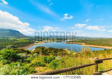 a wooden handrail by Temo lake Sardinia