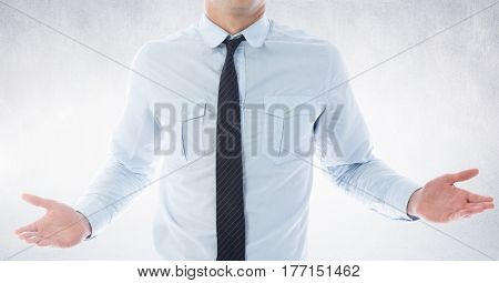 Digital composite of Businessman Torso showing his hands against neutral grey background