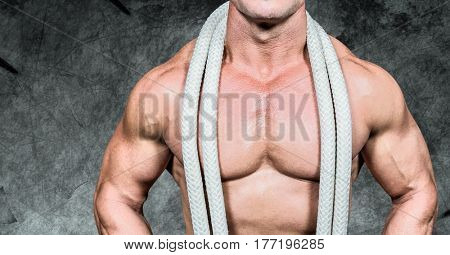 Digital composite of man Fitness Torso against dark background