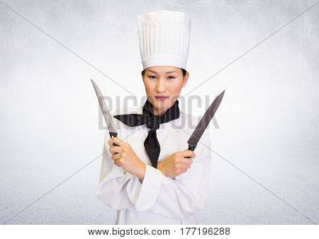 Digital composite of Chef with knives against white background