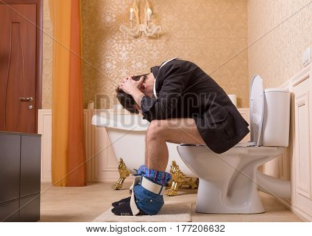 Diarrhea or constipation problem, man on toilet