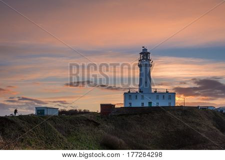Sunset at Flamborough Head Lighthouse - Flamborough Head is an eight mile long promontory on the Yorkshire coastline. It is a chalk headland with sheer white cliffs
