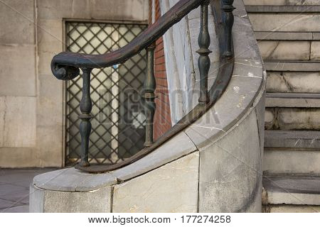 Photo of a metal railing with cold colour and sunlight
