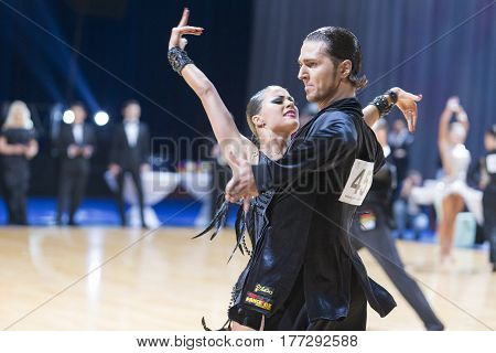 Minsk Belarus-February 19 2017: Professional Dance Couple of Gerasimov Svyatoslav and Zakharchuk Anastasia Performs Adults Latin-American Program on WDSF Minsk Open Dance Festival-2017 on February 19 2017 in Minsk Belarus.