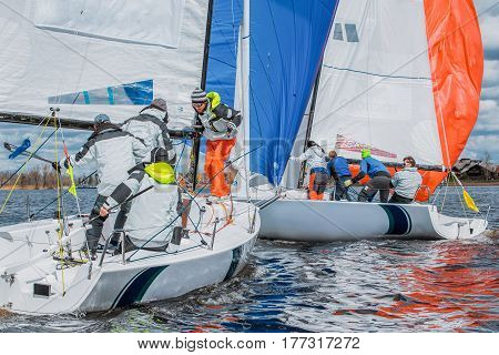 Konakovo , April 19 : Public open. Team athletes participating in the sailing competition - match race , held in Konakovo on river Volga April 19, 2016