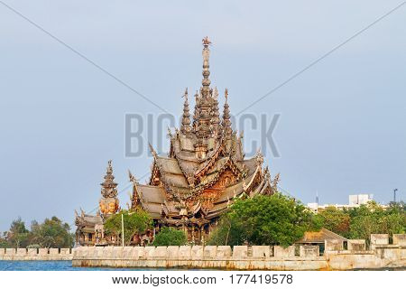 Sanctuary of Truth all-wood building filled with sculptures based on traditional Buddhist and Hindu motives. Pattaya Thailand. View from sea.