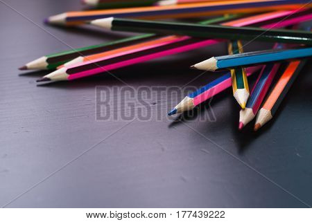 Colored Pencils Scattered On The Desk